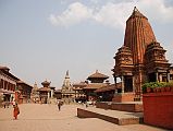 Kathmandu Bhaktapur 01 Bhaktapur Durbar Square From West With Shiva Kedarnath Temple Bhaktapur (1401m) is a traffic-free city 13 km east of Kathmandu, with cobblestone streets linking a string of temples, courtyards and squares. Bhaktapur Durbar Square is one of the world heritage sites in Nepal, reflecting the city's rich culture, art and architectural design. The 1934 earthquake destroyed many of Bhaktapurs Durbar Square temples. Here is a view of Bhaktapur Durbar Square from the west, with the Golden Gate and Palace of 55 Windows on the left, the Vatsala Durga Temple in the centre, and Shiva Kedarnath Temple on the right.